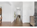 Bright entryway hallway with hardwood floors and white trim at 116 Maggie Dr, Mount Holly, NC 28120