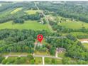 An aerial view shows the property's location at 132 Homeplace Lane, surrounded by trees and countryside at 132 Homeplace Ln, Statesville, NC 28625