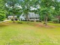 A scenic aerial view showcases the home nestled within a lush, tree-filled landscape at 132 Homeplace Ln, Statesville, NC 28625