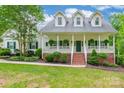 Inviting home exterior with a brick-lined front porch, perfect for relaxing outdoors at 132 Homeplace Ln, Statesville, NC 28625