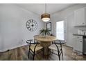 Cozy dining area features a stylish table, modern chairs, and a decorative pendant light at 149 Briana Marie Way, Indian Trail, NC 28079