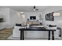Bright living room featuring modern furnishings, sleek ceiling fan, and stylish decor at 149 Briana Marie Way, Indian Trail, NC 28079