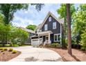 Charming two-story home with manicured landscaping and a two-car garage at 1620 Arnold Dr, Charlotte, NC 28205