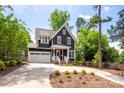 Beautiful two-story home with a two-car garage and a well-manicured lawn at 1620 Arnold Dr, Charlotte, NC 28205
