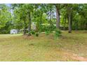 Secluded home on lush property with shade trees and a separate outbuilding offering endless possibilities at 16453 Nc Hwy 73 Hwy, Albemarle, NC 28001