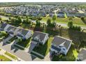 Stunning aerial perspective of a neighborhood showcasing well-manicured lawns and beautiful homes at 1725 Mill Creek Sw Ln, Concord, NC 28025