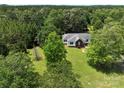 Aerial view of a charming home nestled among lush trees, providing a private and serene setting at 4636 Brown Creek Church Rd, Wadesboro, NC 28170