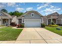 Beautiful home with a two-car garage, concrete driveway, and well-maintained lawn at 5141 Grandview Dr, Fort Mill, SC 29707