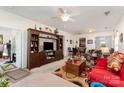 Spacious living room features a ceiling fan, tv, wood floors and an open layout at 5141 Grandview Dr, Fort Mill, SC 29707