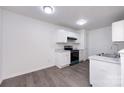 Modern kitchen with white cabinetry, updated appliances, and sleek countertops at 5343 Esther Ln, Charlotte, NC 28214