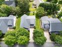 Overhead view of a home with a dark roof and a large, well-maintained yard with mature trees at 5428 Colonial Garden Dr, Huntersville, NC 28078