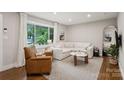 Bright living room featuring a comfortable sofa, natural light, and stylish decor at 1021 Nancy Dr, Charlotte, NC 28211