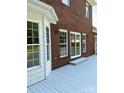 View of house from the gray painted deck with white trim and manicured lawn at 111 Billy Joe Rd, Mooresville, NC 28117