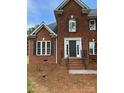 Charming brick two-story home with a welcoming front entrance and mature landscaping at 111 Billy Joe Rd, Mooresville, NC 28117