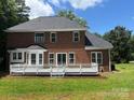 Spacious two-story brick home with a large deck, perfect for outdoor entertaining at 111 Billy Joe Rd, Mooresville, NC 28117