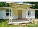 Close-up of a covered front porch with decorative metal supports and the house number clearly visible at 13821 David St, Huntersville, NC 28078