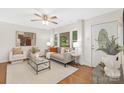 Cozy living room with hardwood floors, ample natural light, and stylish furniture at 1734 Seifert Cir, Charlotte, NC 28205