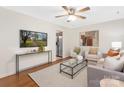 Bright living room featuring hardwood floors, neutral colors, and modern decor at 1734 Seifert Cir, Charlotte, NC 28205