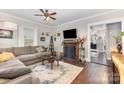 Cozy living room featuring a fireplace, hardwood floors, and neutral decor at 215 S Shaver St, Salisbury, NC 28144