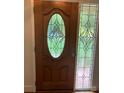 Elegant front door featuring decorative stained glass window and sidelight, adding a touch of sophistication at 2222 Raven Dr, Rock Hill, SC 29732