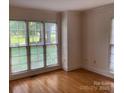 Sunlit living room with hardwood floors and large windows providing a beautiful view at 2222 Raven Dr, Rock Hill, SC 29732