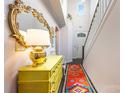Chic entryway featuring decorative mirror and a bright yellow chest of drawers at 2313 Blueberry St, Belmont, NC 28012