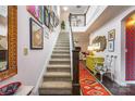 Bright and airy entryway featuring a grand staircase and eclectic decor at 2313 Blueberry St, Belmont, NC 28012