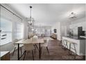Bright and airy living space featuring an open floorplan with dining and kitchen areas at 240 Briana Marie Way, Indian Trail, NC 28079