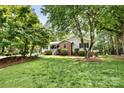 Well-maintained lawn and landscaping surround this traditional home with brick and siding at 2434 Olewoods Ct, Rock Hill, SC 29732