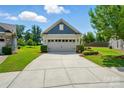 Charming home exterior showcasing a well-maintained lawn and a convenient two-car garage at 258 Cherrytree Dr, Fort Mill, SC 29715