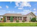 Charming brick home with a covered front porch, stone accents, and well-manicured landscaping at 2843 Startown Rd, Lincolnton, NC 28092