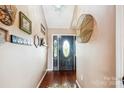 Elegant entryway with hardwood floors and a decorative front door with a glass panel at 2843 Startown Rd, Lincolnton, NC 28092