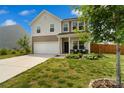 Beautiful home with a well-maintained lawn, featuring a front porch with seating and a charming curb appeal at 3092 Riker St, Clover, SC 29710