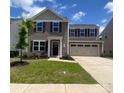 Charming two-story home featuring a well-maintained lawn and a two-car garage at 3113 Bouquet St, Charlotte, NC 28215