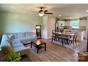 Inviting living room and dining area with wood-look floors and a modern ceiling fan at 3113 Bouquet St, Charlotte, NC 28215