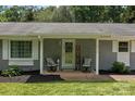 Inviting front porch with charming decor, seating, and stylish details for a warm welcome at 312 Walton Dr, Statesville, NC 28625