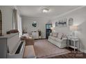 Bright and inviting living room featuring neutral tones, comfortable seating, and elegant decor accents at 312 Walton Dr, Statesville, NC 28625