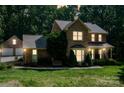 Charming brick two-story home with a covered porch and well-manicured lawn and landscape at 3513 Briarcliff Acres Dr, Lincolnton, NC 28092