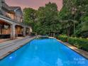 Inviting backyard featuring a large swimming pool and jacuzzi, ideal for entertaining and relaxing by the water at 4290 Barbrick St, Sherrills Ford, NC 28673