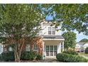 Charming two-story home featuring brick accents and lush landscaping in a well-maintained community at 6443 Mallard View Ln, Charlotte, NC 28269
