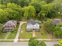 Scenic aerial view of a two-story home with a classic design nestled amongst mature trees and verdant lawns at 7 Kings Mountain St, York, SC 29745