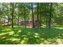 Charming brick home with trees providing privacy and ample shade to the home at 800 Davenport St, Monroe, NC 28112