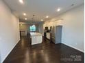 Spacious kitchen featuring a large island with sink, stainless steel appliances, and plenty of counter space at 9236 Ainslie Downs St, Charlotte, NC 28273