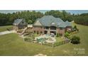 Aerial view of brick home showcasing the private pool, hot tub, and manicured backyard at 109 Oak Forest Dr, Kings Mountain, NC 28086