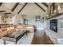 Spacious living room with vaulted ceilings, stone fireplace, and a large leather sectional sofa at 109 Oak Forest Dr, Kings Mountain, NC 28086