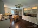 Well-lit kitchen features stainless steel appliances, dark countertops, and sleek cabinetry at 121 33Rd Ne Ave, Hickory, NC 28601