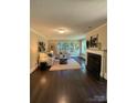 Bright living room with fireplace, hardwood floors, and plenty of natural light at 121 33Rd Ne Ave, Hickory, NC 28601