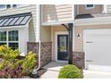 A close up front view of the facade with address, landscaping and stone detail at 14611 Murfield Ct, Charlotte, NC 28278