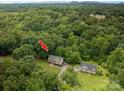 Aerial view of a property with mature trees providing ample shade and privacy at 1520 28Th Sw St, Hickory, NC 28602