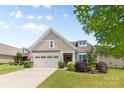 Charming single-Gathering home featuring a two-car garage and well-maintained landscaping at 163 Carmen Way, Lancaster, SC 29720